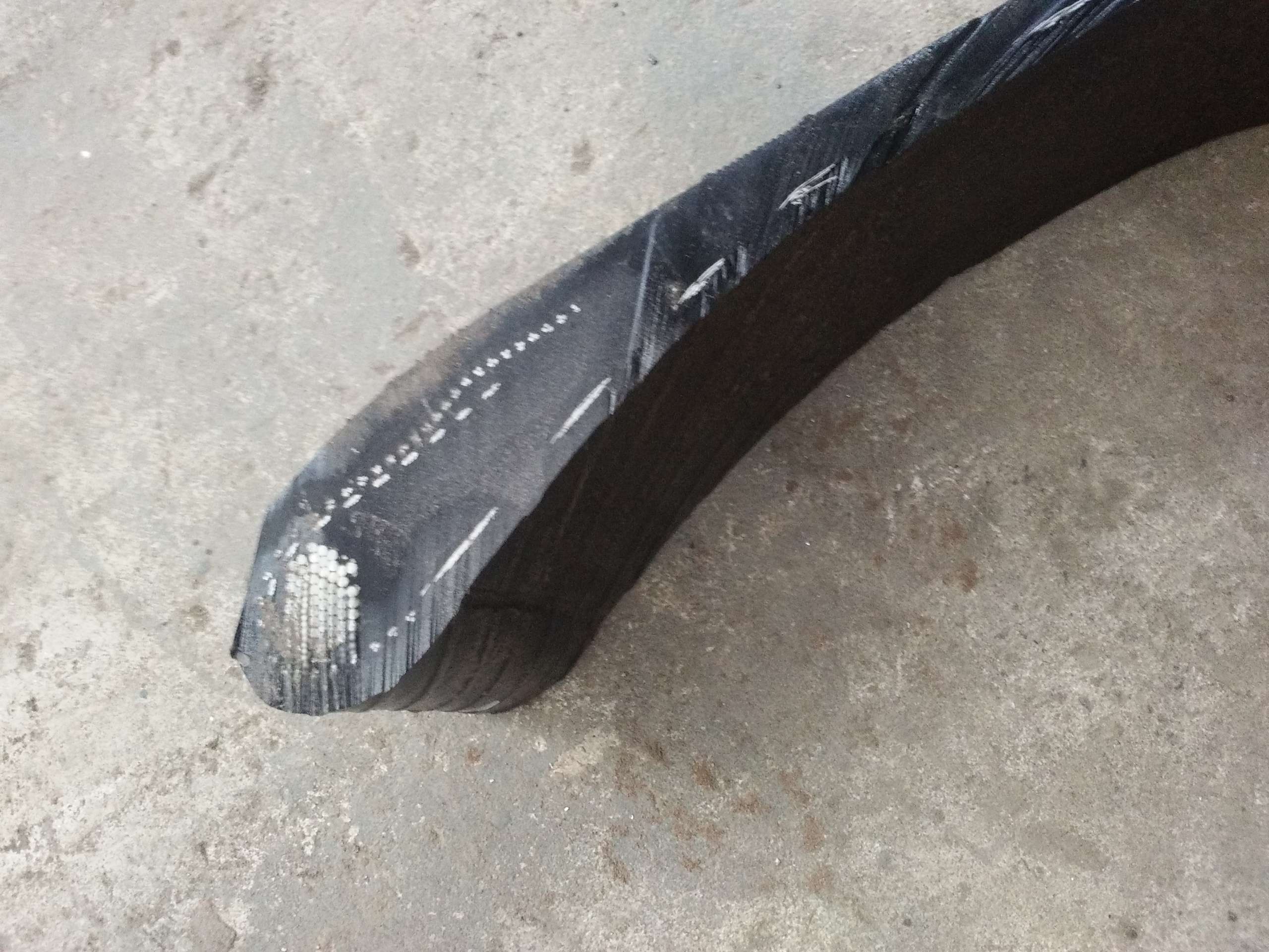 waterjet cuts a strip of tire